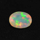 ETHIOPIAN OPAL CUT OVAL 8X6MM (YELLOW BASE) (BLUE GREEN SHINE) 0.75 Cts.