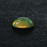 ETHIOPIAN OPAL PLAIN OVAL CAB (YELLOW BASE/MULTI POWER) 8.00X6.00 MM 0.71 CTS