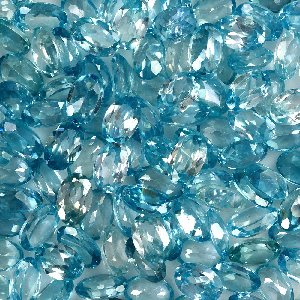 NATURAL BLUE ZIRCON CUT OVAL 6X4MM 0.63 Cts.