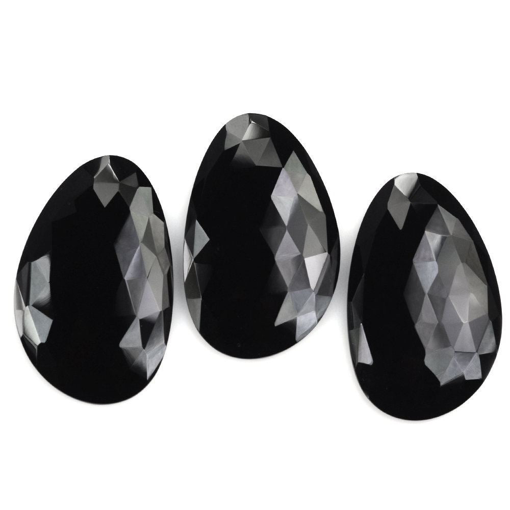 BLACK ONYX ROSE CUT IRREGULAR PEAR CAB 36X22MM 23.83 Cts.