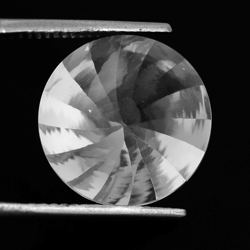 CRYSTAL BUFFTOP ROUND WITH TWISTED CONCAVE (DES#31) 15MM 11.55 Cts.