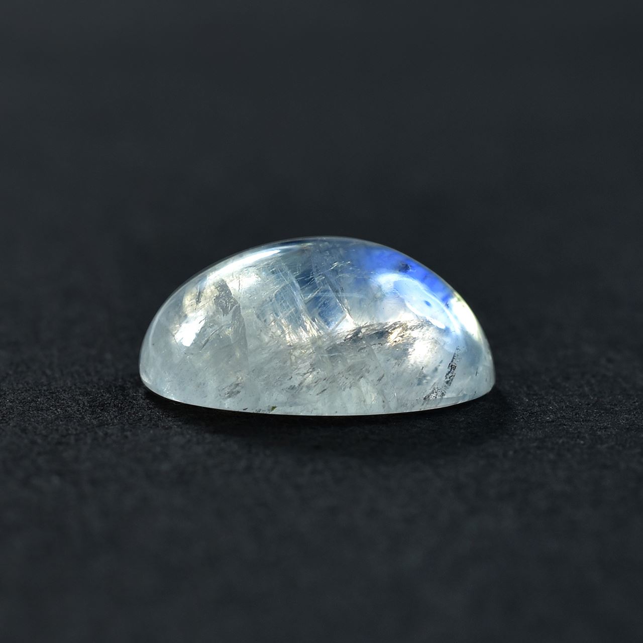 RAINBOW MOONSTONE PLAIN OVAL CAB (SEMI CLOUDY)(HI) 14.00X12.00 MM 7.54 Cts.