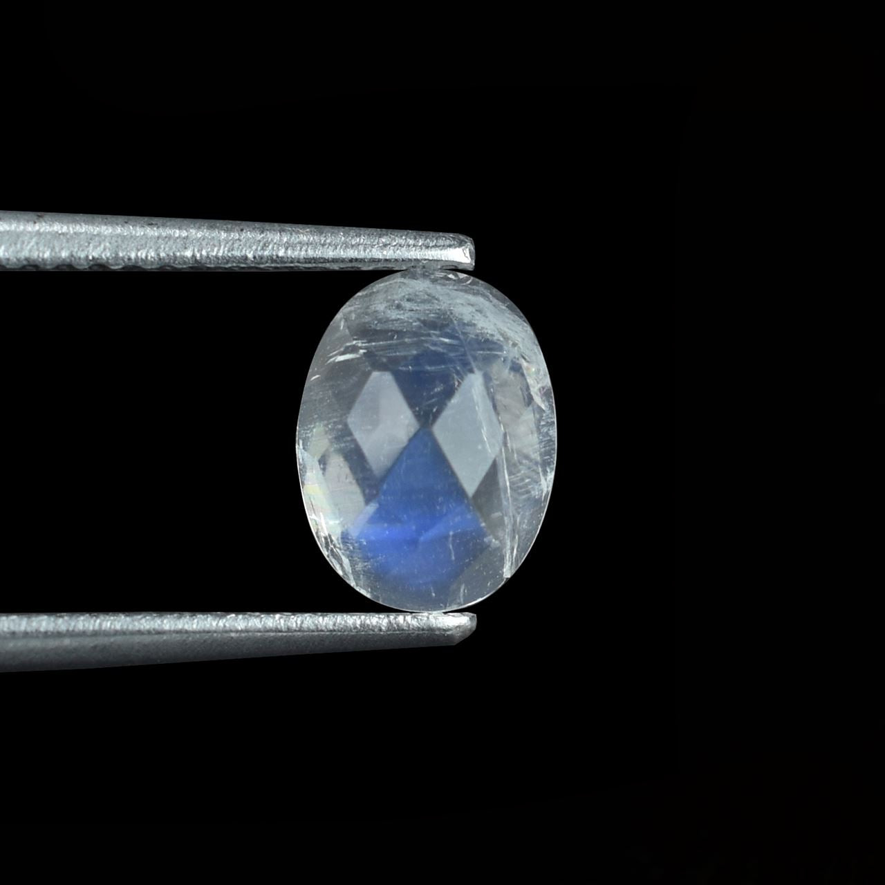 RAINBOW MOONSTONE CHECKER CUT OVAL CAB (SEMI CLOUDY)(NICE BLUE SHINE) 8.00X6.00 MM 1.22 Cts.