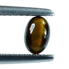 YELLOW TIGER'S EYE QUARTZ OVAL CAB 6X4MM 0.66 Cts.