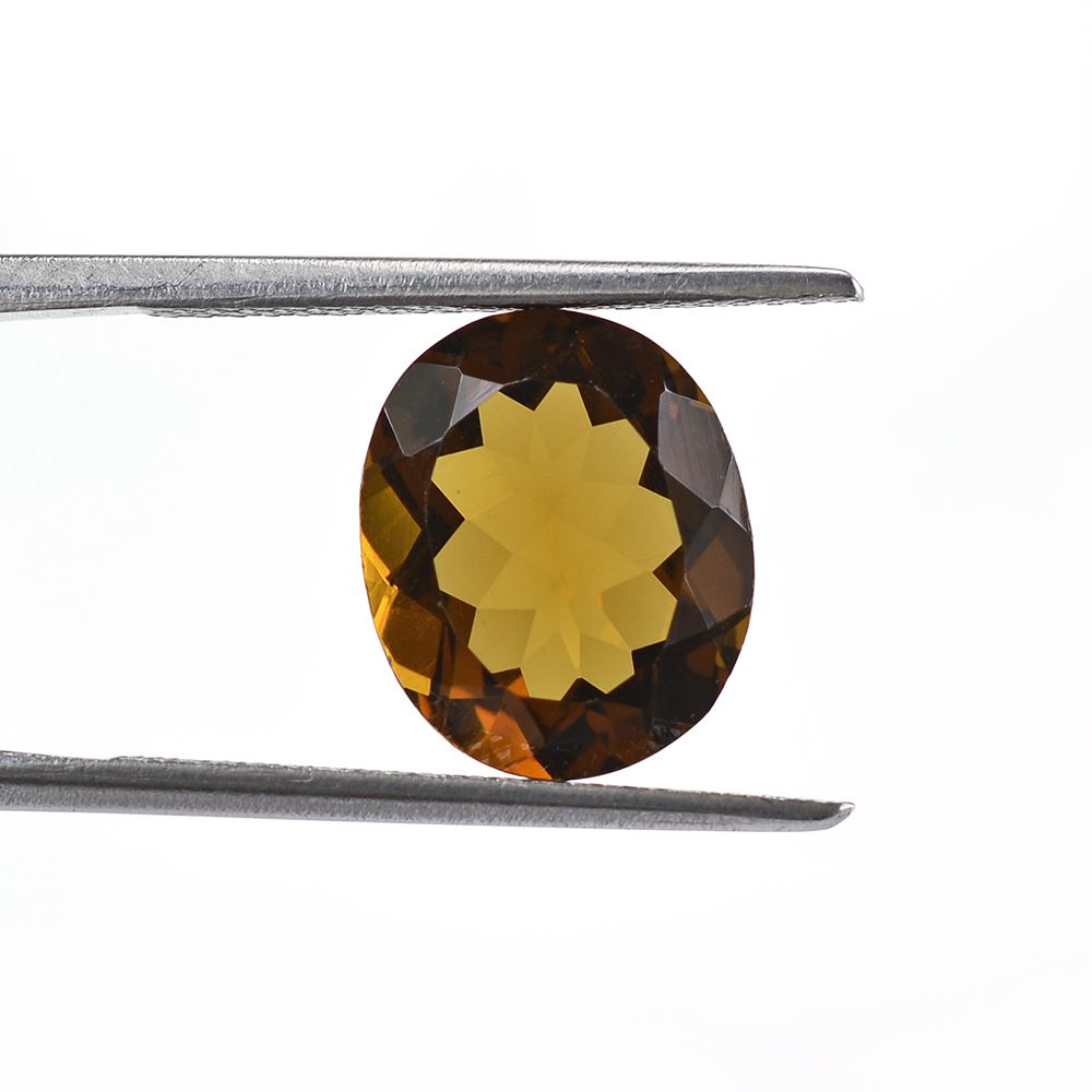 WHISKY QUARTZ CUT OVAL 12X10MM 3.8Cts.