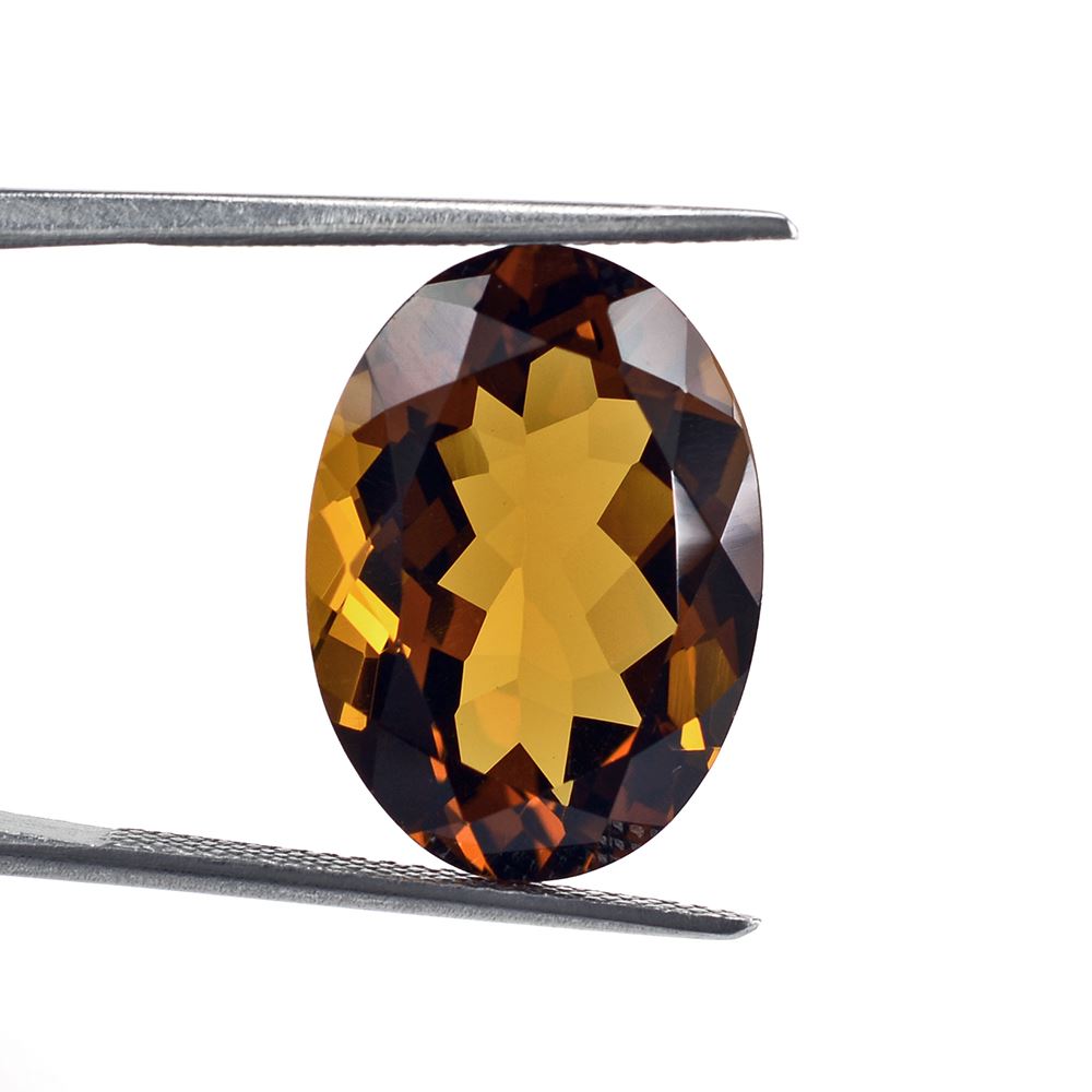 WHISKY QUARTZ CUT OVAL 18X13MM 10.59Cts.