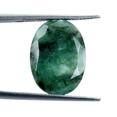EMERALD BOTH SIDE TABLE CUT OVAL (OPAQUE)(GREEN/MANY BLACK SPOTS) 18.00X13.00 MM 6.18 CTS