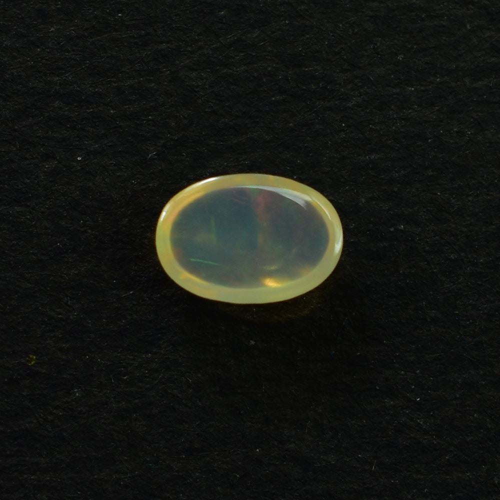 ETHIOPIAN OPAL PLAIN OVAL CAB (YELLOW TRANSPARENT/BLUE GREEN POWER) 6.00X4.00 MM 0.24 CTS