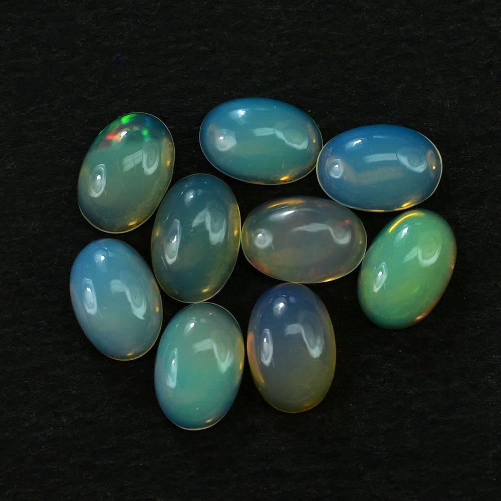 ETHIOPIAN OPAL PLAIN OVAL CAB (YELLOW TRANSPARENT/BLUE GREEN POWER) 6.00X4.00 MM 0.24 CTS