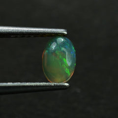 ETHIOPIAN OPAL PLAIN OVAL CAB (YELLOWISH/MULTI POWER) 6.00X4.00 MM 0.26 CTS