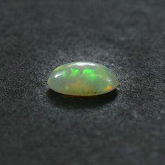 ETHIOPIAN OPAL PLAIN OVAL CAB (WHITE BASE/MULTI POWER) 6.00X4.00 MM 0.25 CTS