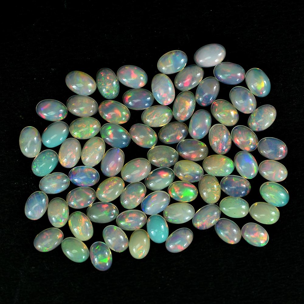 ETHIOPIAN OPAL PLAIN OVAL CAB (WHITE BASE/MULTI POWER) 6.00X4.00 MM 0.25 CTS