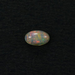 ETHIOPIAN OPAL PLAIN OVAL CAB (YELLOWISH/MULTI POWER) 5.00X3.00 MM 0.12 CTS