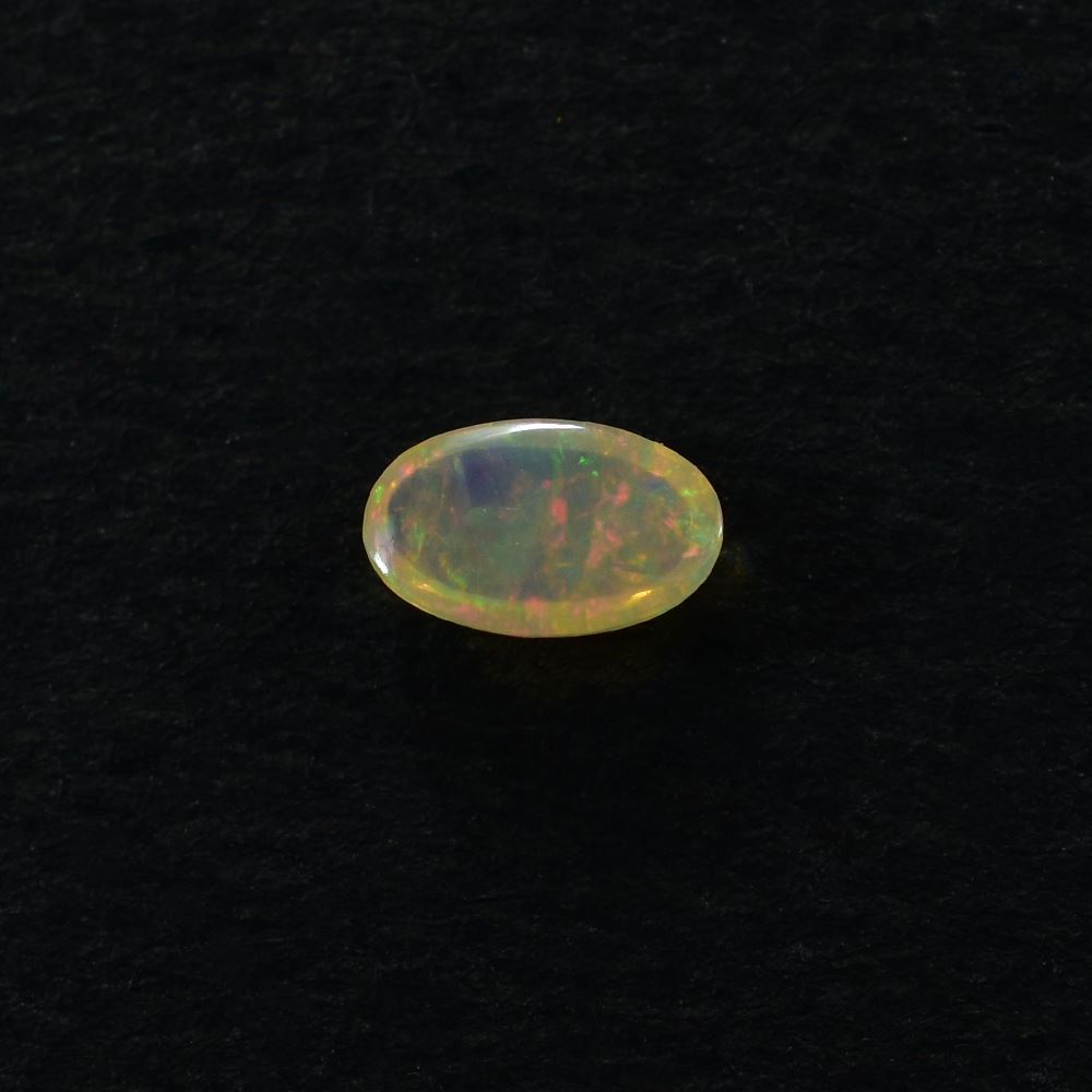 ETHIOPIAN OPAL PLAIN OVAL CAB (YELLOWISH/MULTI POWER) 5.00X3.00 MM 0.12 CTS