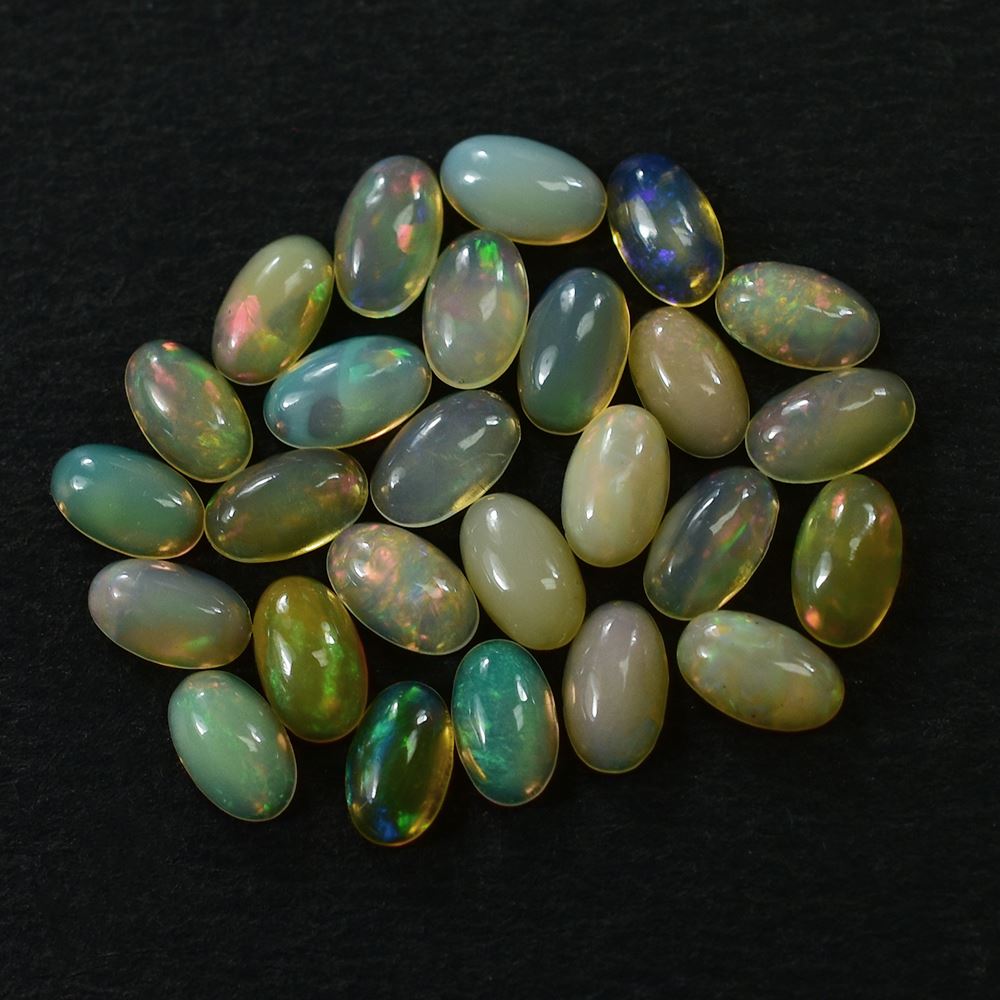 ETHIOPIAN OPAL PLAIN OVAL CAB (YELLOWISH/MULTI POWER) 5.00X3.00 MM 0.12 CTS