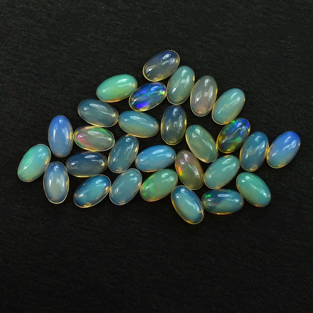 ETHIOPIAN OPAL PLAIN OVAL CAB (YELLOWISH TRANSPARENT/VERY LOW POWER) 5.00X3.00 MM 0.12 CTS