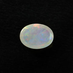 ETHIOPIAN OPAL PLAIN OVAL CAB (OFF WHITE MILKY/VERY LOW MULTI POWER) 8.00X6.00 MM 0.73 CTS