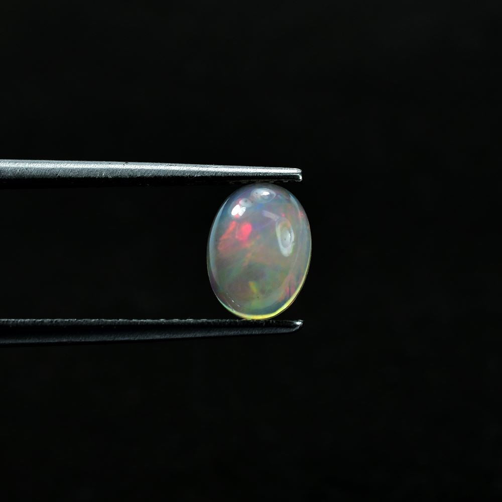 ETHIOPIAN OPAL PLAIN OVAL CAB (OFF WHITE MILKY/VERY LOW MULTI POWER) 8.00X6.00 MM 0.73 CTS