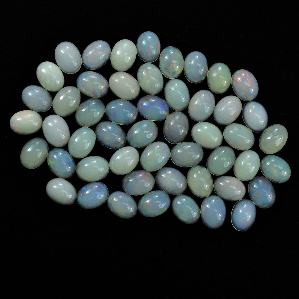 ETHIOPIAN OPAL PLAIN OVAL CAB (OFF WHITE MILKY/VERY LOW MULTI POWER) 8.00X6.00 MM 0.73 CTS