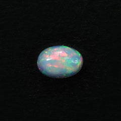 ETHIOPIAN OPAL PLAIN OVAL CAB (WHITE BASE/GREEN POWER) 7.00X5.00 MM 0.47 CTS