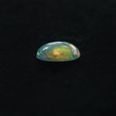 ETHIOPIAN OPAL PLAIN OVAL CAB (WHITE BASE/GREEN POWER) 7.00X5.00 MM 0.47 CTS