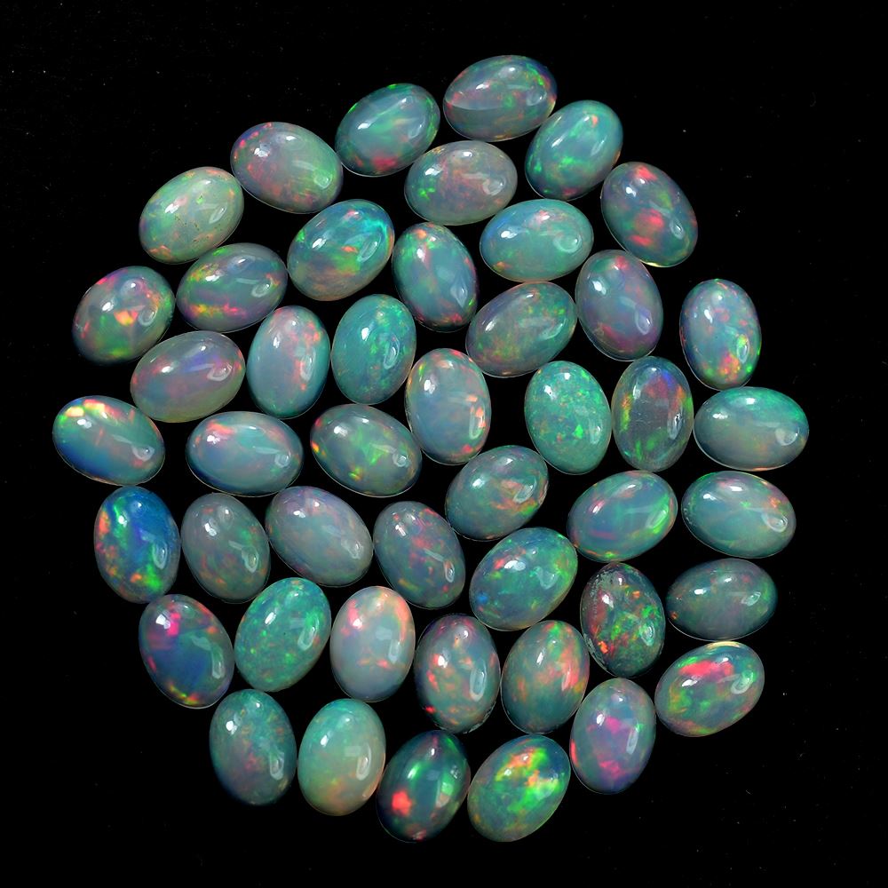 ETHIOPIAN OPAL PLAIN OVAL CAB (WHITE BASE/GREEN POWER) 7.00X5.00 MM 0.47 CTS