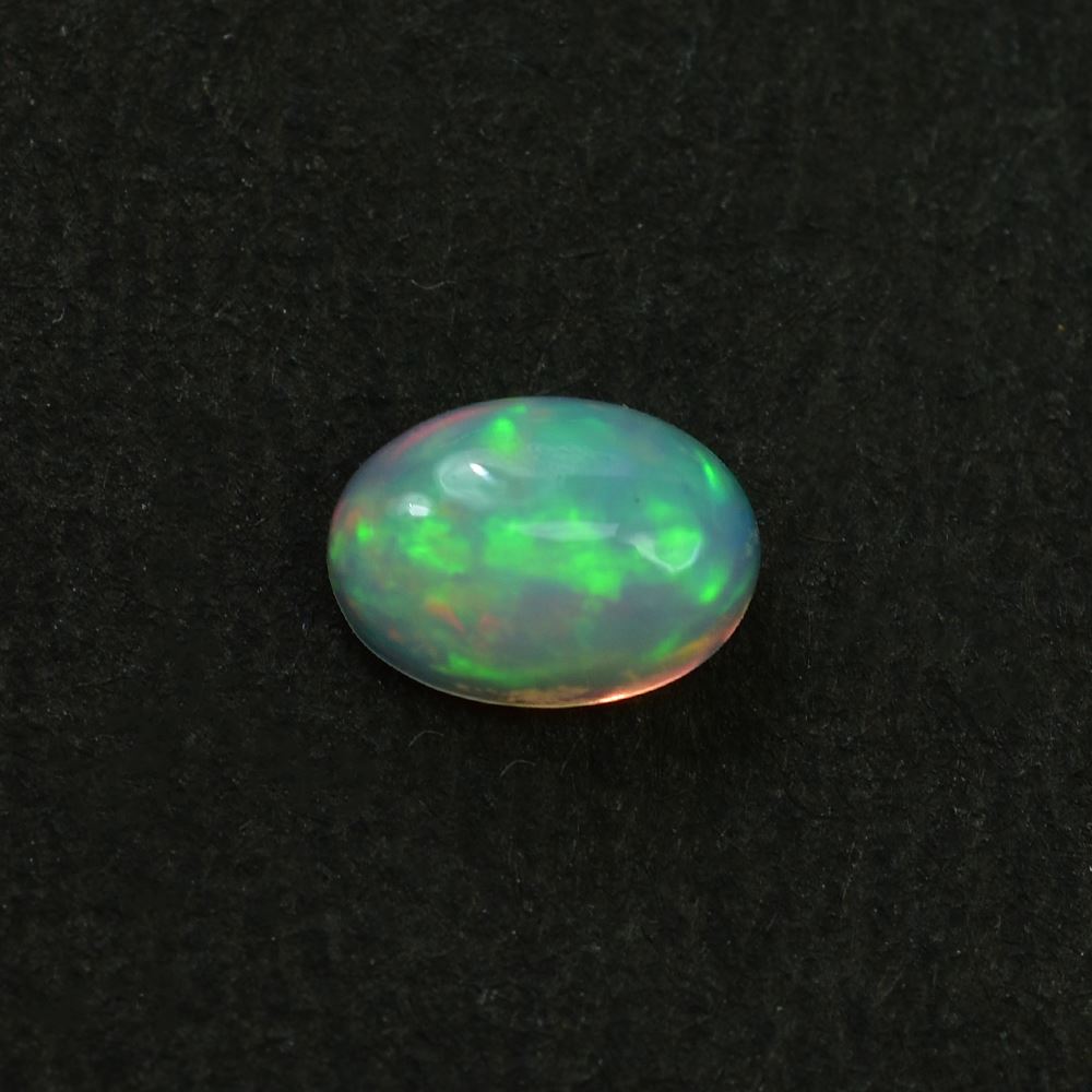 ETHIOPIAN OPAL PLAIN OVAL CAB (YELLOW BASE/BLUE GREEN POWER) 7.00X5.00 MM 0.48 CTS