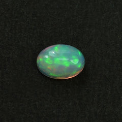 ETHIOPIAN OPAL PLAIN OVAL CAB (YELLOW BASE/BLUE GREEN POWER) 7.00X5.00 MM 0.48 CTS