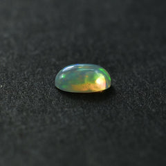 ETHIOPIAN OPAL PLAIN OVAL CAB (YELLOW BASE/BLUE GREEN POWER) 7.00X5.00 MM 0.48 CTS