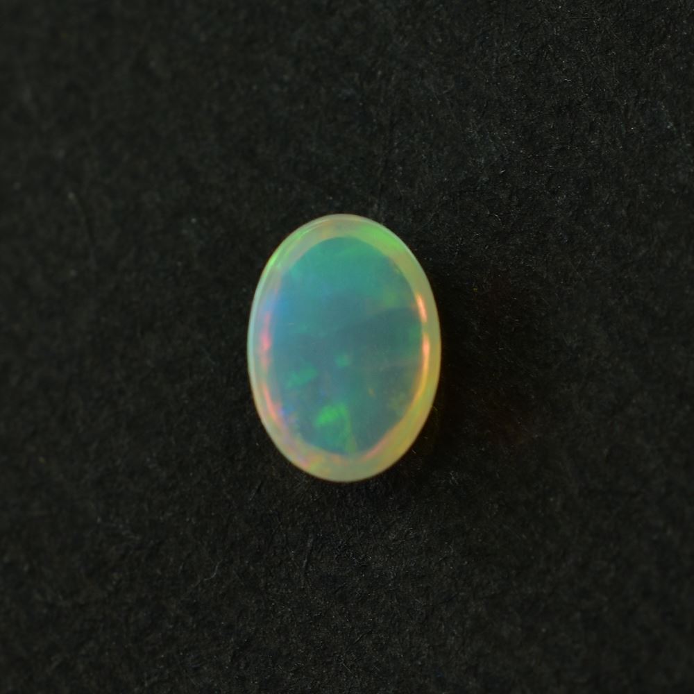 ETHIOPIAN OPAL PLAIN OVAL CAB (YELLOW BASE/BLUE GREEN POWER) 7.00X5.00 MM 0.48 CTS