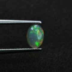 ETHIOPIAN OPAL PLAIN OVAL CAB (YELLOW BASE/BLUE GREEN POWER) 7.00X5.00 MM 0.48 CTS