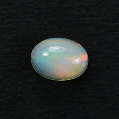 ETHIOPIAN OPAL PLAIN OVAL CAB (OFF WHITE /MILKY/RED GREEN POWER) 8.00X6.00 MM 0.75 CTS