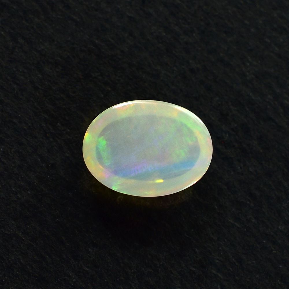 ETHIOPIAN OPAL PLAIN OVAL CAB (OFF WHITE /MILKY/RED GREEN POWER) 8.00X6.00 MM 0.75 CTS