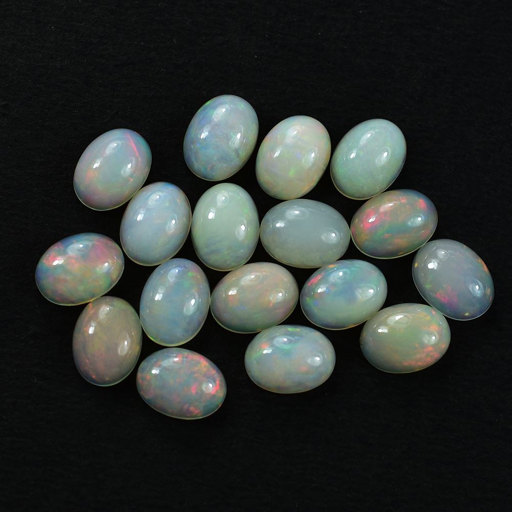 ETHIOPIAN OPAL PLAIN OVAL CAB (OFF WHITE /MILKY/RED GREEN POWER) 8.00X6.00 MM 0.75 CTS