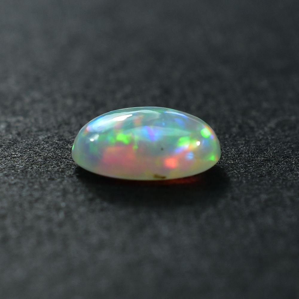 ETHIOPIAN OPAL PLAIN OVAL CAB (WHITE BASE/BLUE GREEN POWER) 8.00X6.00 MM 0.77 CTS