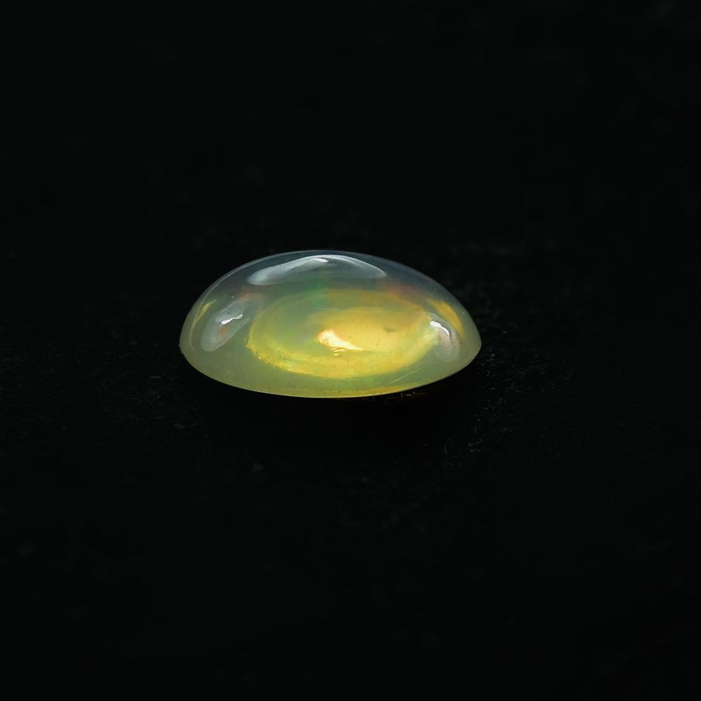 ETHIOPIAN OPAL PLAIN OVAL CAB (YELLOWISH TRANSPARENT/VERY LOW POWER) 7.00X5.00 MM 0.46 CTS