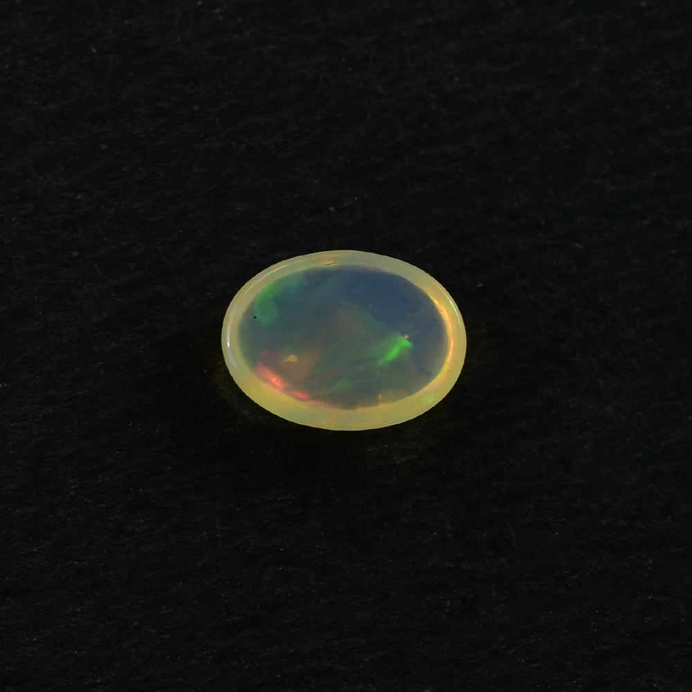 ETHIOPIAN OPAL PLAIN OVAL CAB (YELLOWISH TRANSPARENT/VERY LOW POWER) 7.00X5.00 MM 0.46 CTS