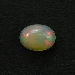 ETHIOPIAN OPAL PLAIN OVAL CAB (YELLOWISH BASE/MULTI POWER MILKY) 7.00X5.00 MM 0.46 CTS