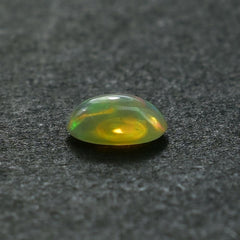 ETHIOPIAN OPAL PLAIN OVAL CAB (YELLOWISH BASE/MULTI POWER MILKY) 7.00X5.00 MM 0.46 CTS