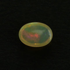 ETHIOPIAN OPAL PLAIN OVAL CAB (YELLOWISH BASE/MULTI POWER MILKY) 7.00X5.00 MM 0.46 CTS