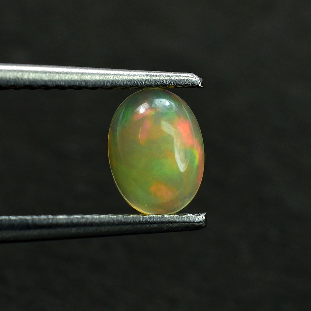 ETHIOPIAN OPAL PLAIN OVAL CAB (YELLOWISH BASE/MULTI POWER MILKY) 7.00X5.00 MM 0.46 CTS