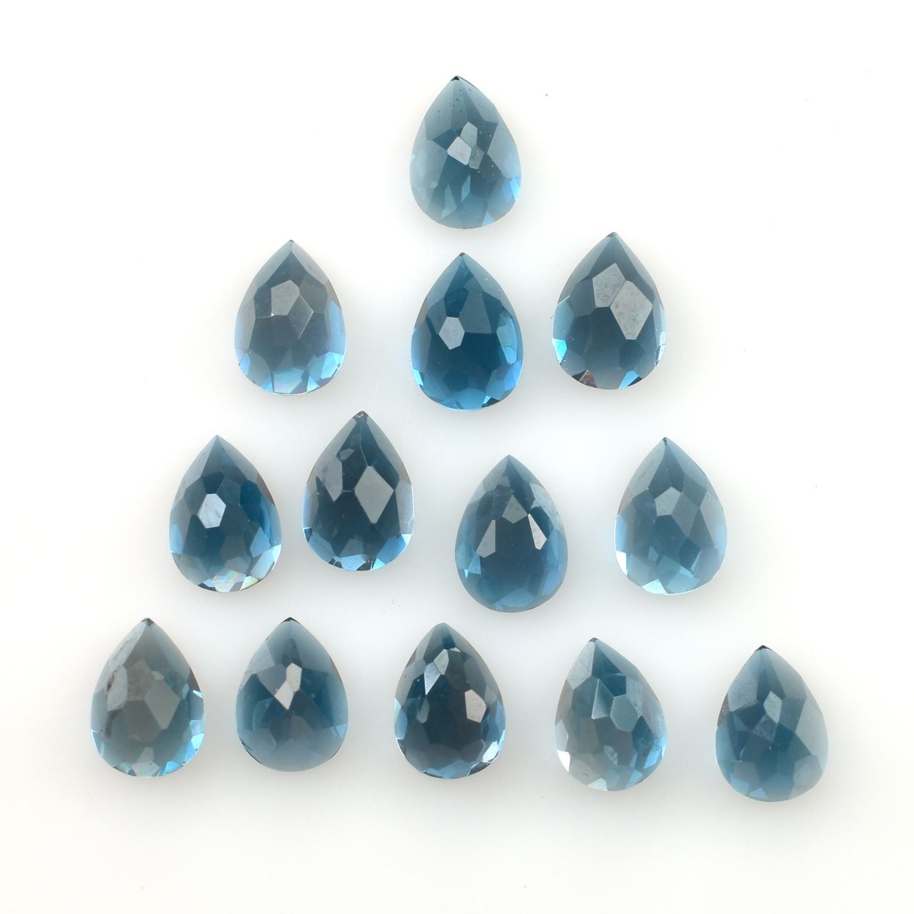 LONDON BLUE TOPAZ IRREGULAR CUT PEAR (NORMAL)(CLEAN) 7.00X5.00 MM 0.94 Cts.