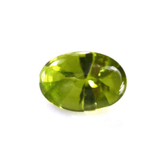 PERIDOT BUFFTOP OVAL WITH TWISTED CONCAVE BACK OVAL (DES#31) 6X4MM 0.60 Cts.