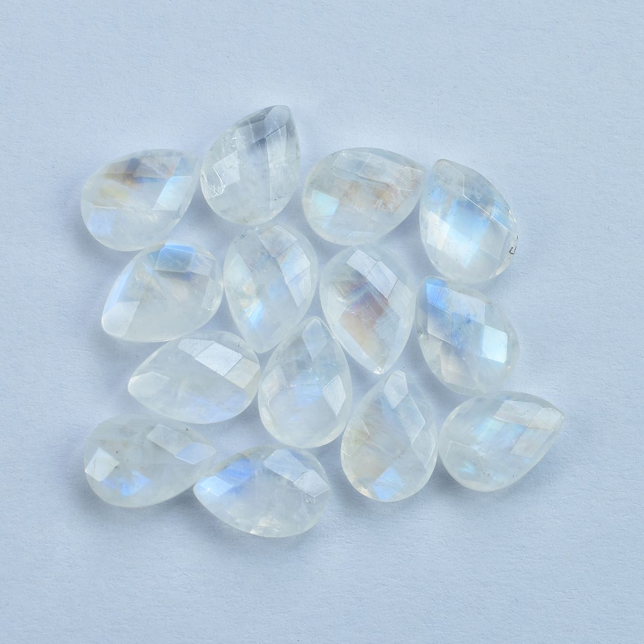 RAINBOW MOONSTONE CHECKER BRIOLETTE PEAR (SEMI CLOUDY)( NICE BLUE SHINE) 10.00X7.00 MM 1.61 Cts.