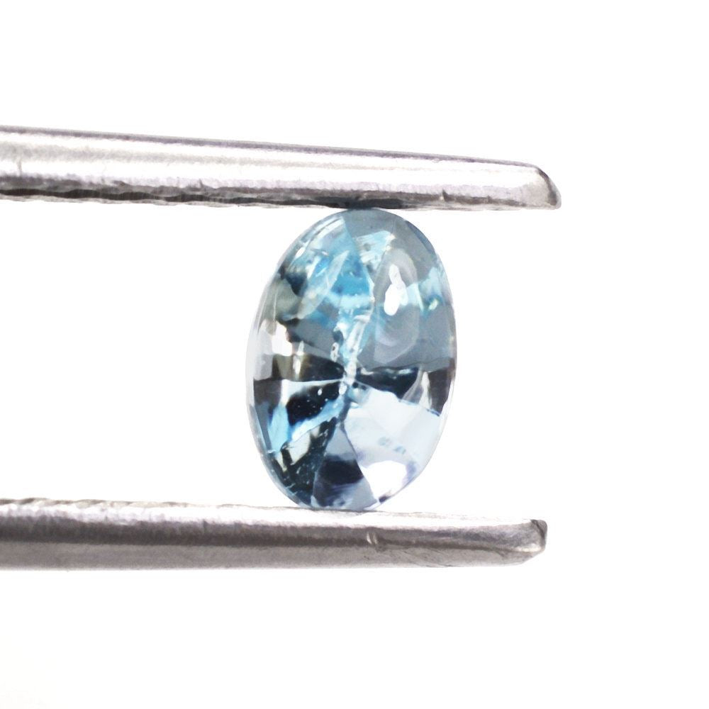 SKY BLUE TOPAZ BUFFTOP OVAL WITH TWISTED CONCAVE BACK (DES#31) 6X4MM 0.68 Cts.