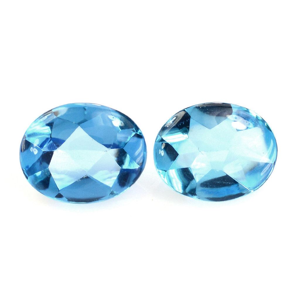 SWISS BLUE TOPAZ BUFFTOP OVAL 10X8MM 2.87 Cts.