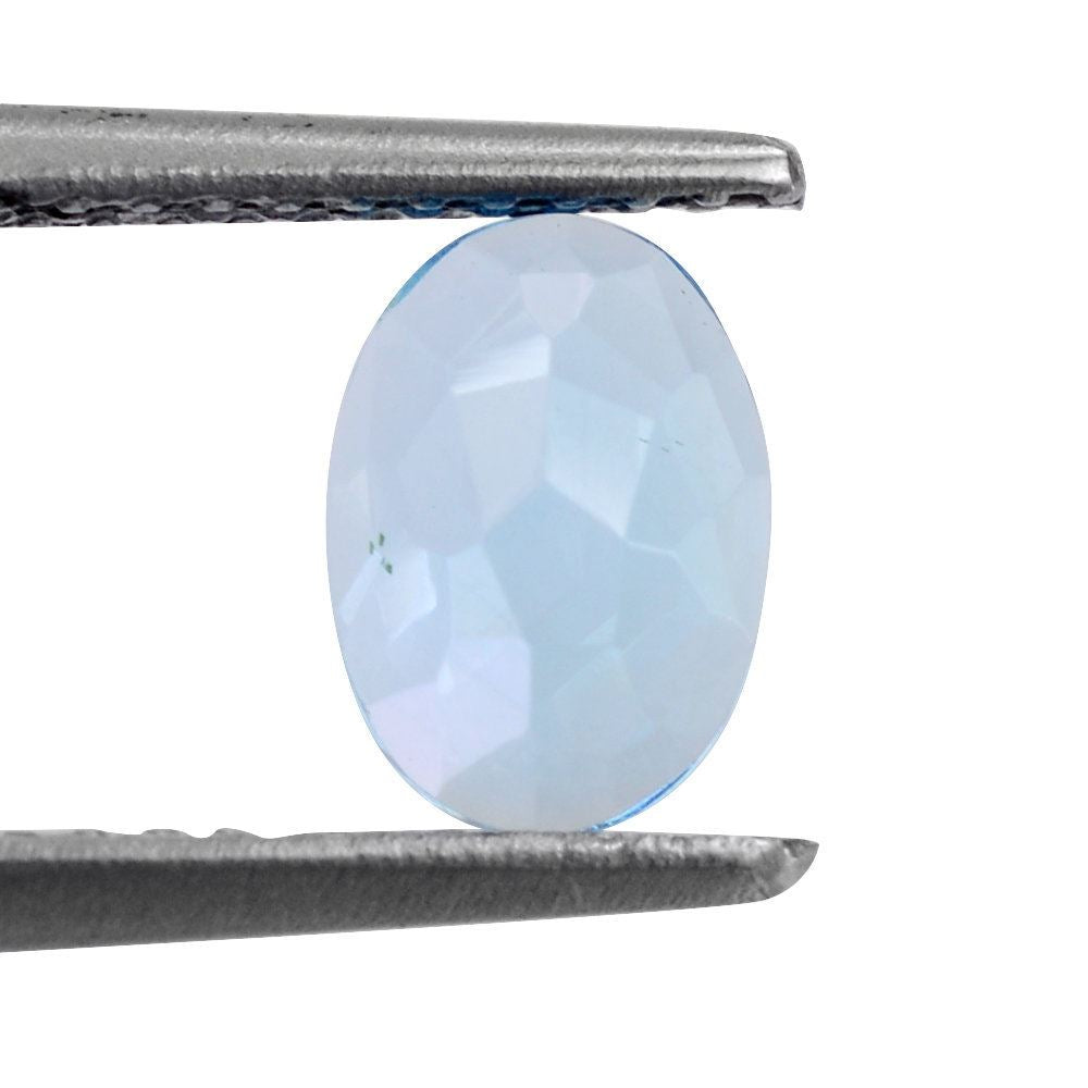 SWISS BLUE TOPAZ IRREGULAR CUT OVAL CAB 7X5MM 0.92 Cts.