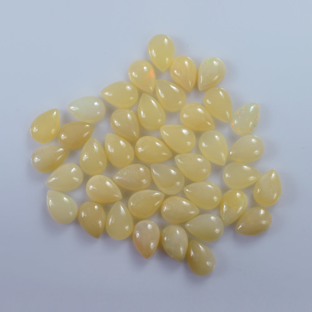 WHITE OPAL (YELLOW) ( MILKY) (OPAQUE) PLAIN PEAR CAB 10.00X7.00 MM 1.01 Cts.