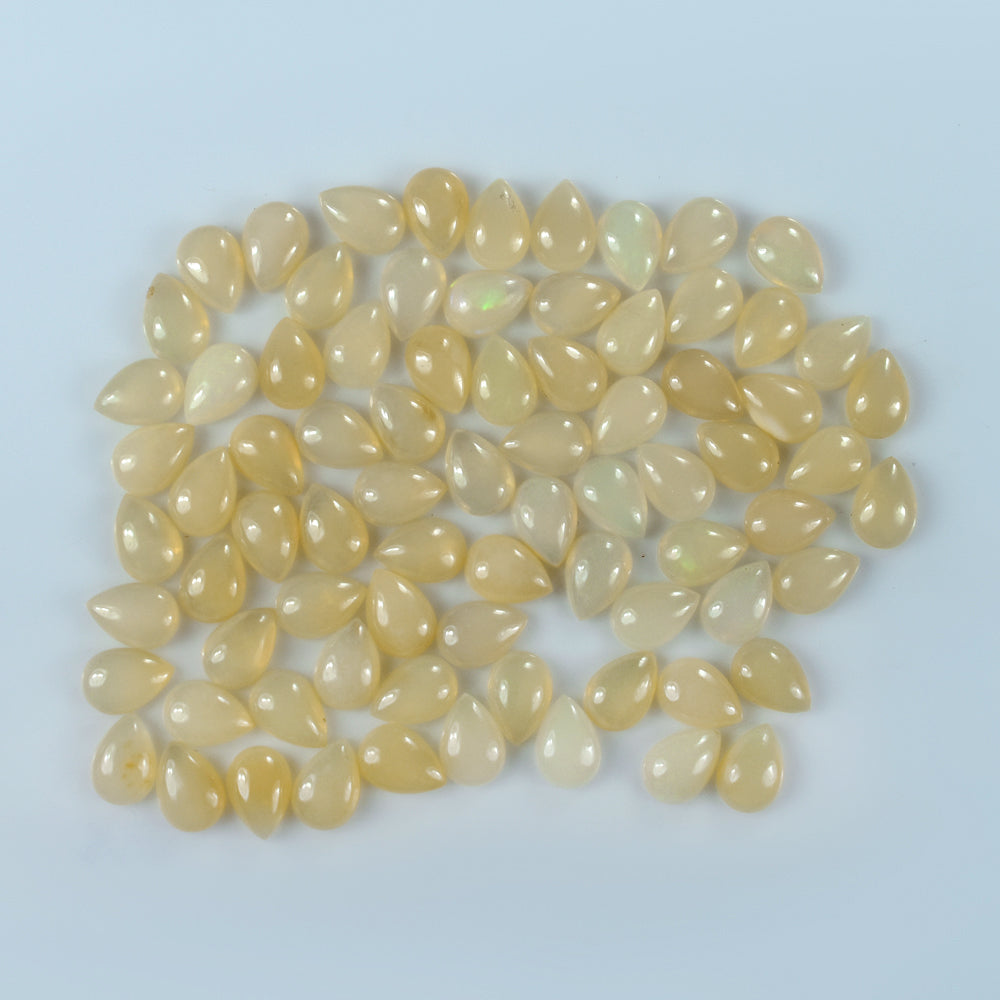 WHITE OPAL (YELLOW) ( TRANSLUCENT) PLAIN PEAR CAB 10.00X7.00 MM 1.06 Cts.
